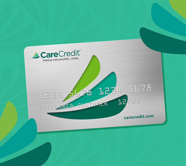 CareCredit payment card displayed on turquoise background with green leaf design elements.