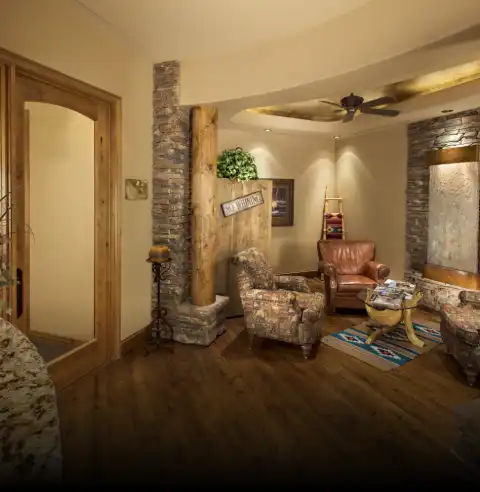 Warm, welcoming dental office waiting room with comfortable seating and modern decor.